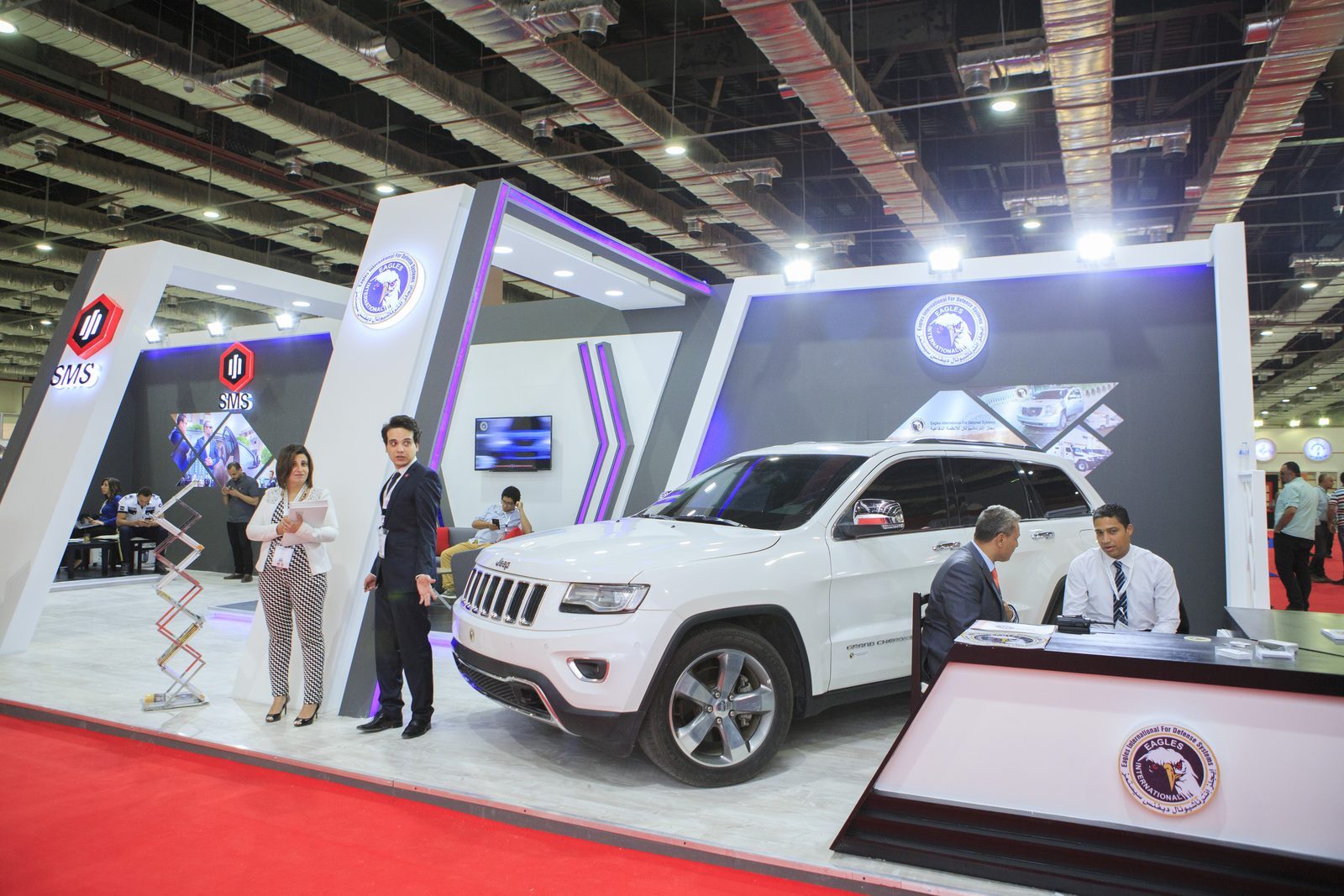 Exhibitor stand with a white SUV on display at EGYSEC 2018