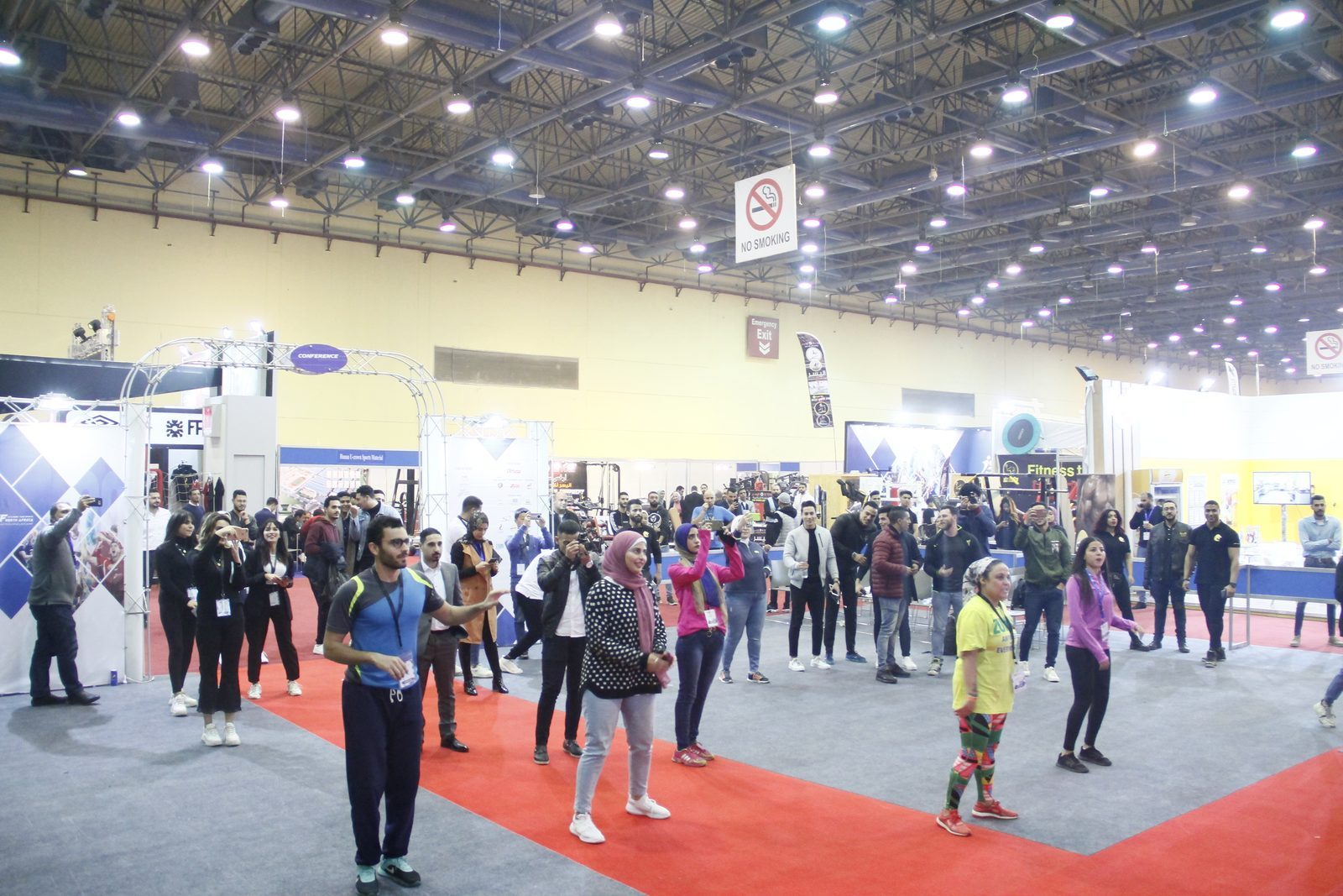 Open fitness session on the busy exhibition floor