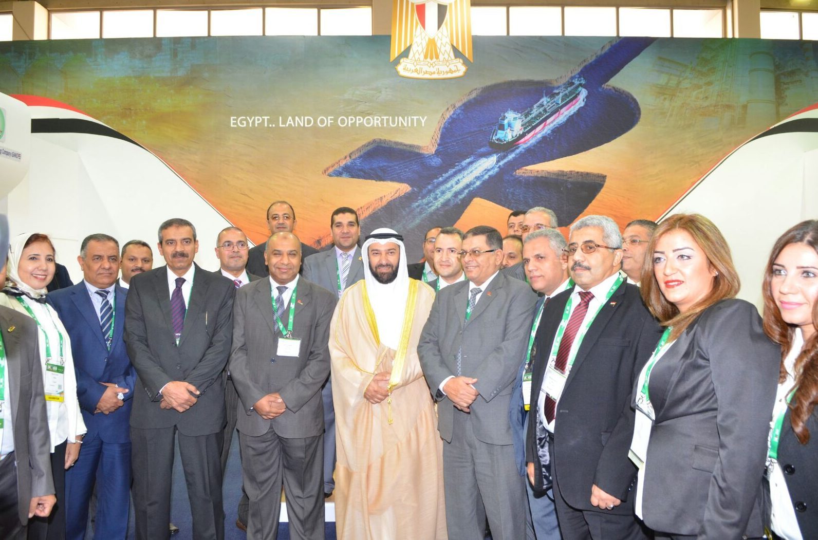Official with the Egyptian delegation at the pavilion backdrop 'EGYPT.. LAND OF OPPORTUNITY'