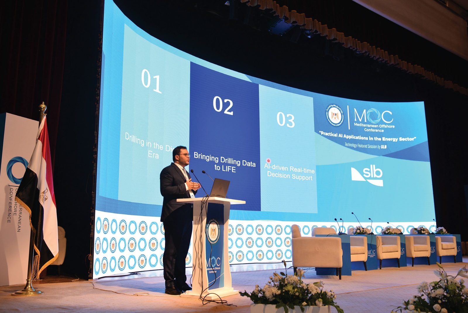 Main stage with the curved LED wall during SLB's technology featured session on AI in the energy sector