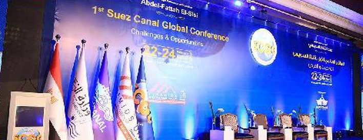 1st Suez Canal Global Conference 2016 stage with event branding, 22-24 dates and flags